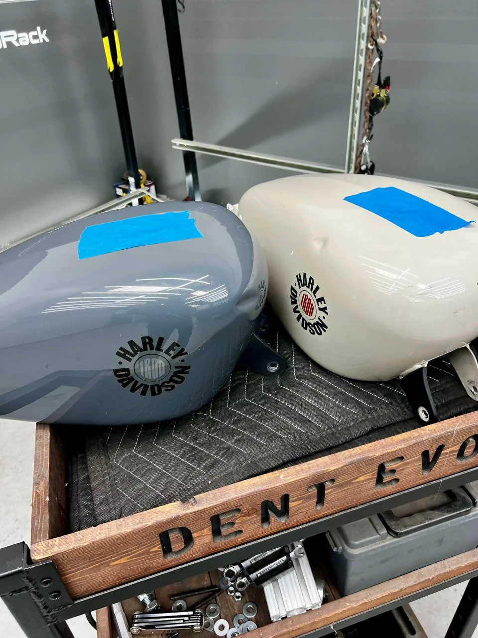 Multiple Harley Davidson tanks staged for paintless dent repair at Dent Evo, Upland California