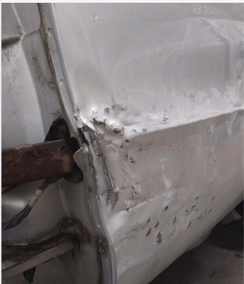 Body filler cracking and peeling off a sanded-down panel from a failed repair