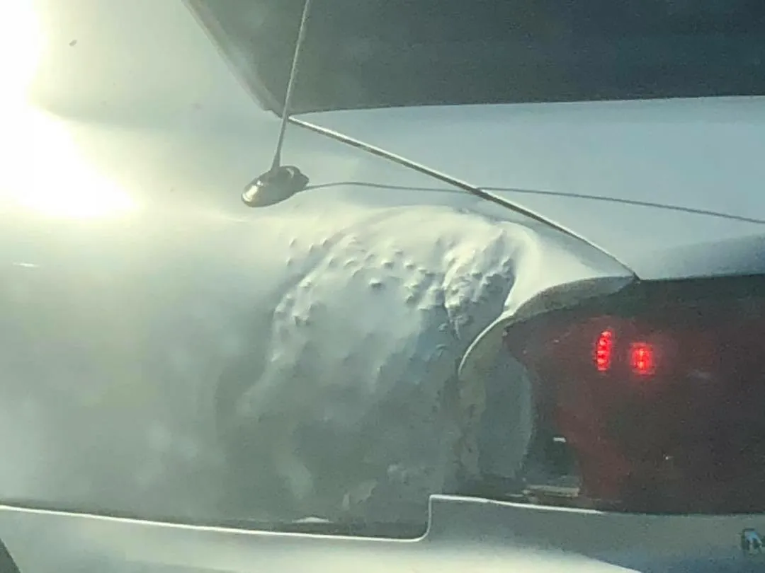 Car quarter panel covered in bumps and high spots from a dent worked too aggressively